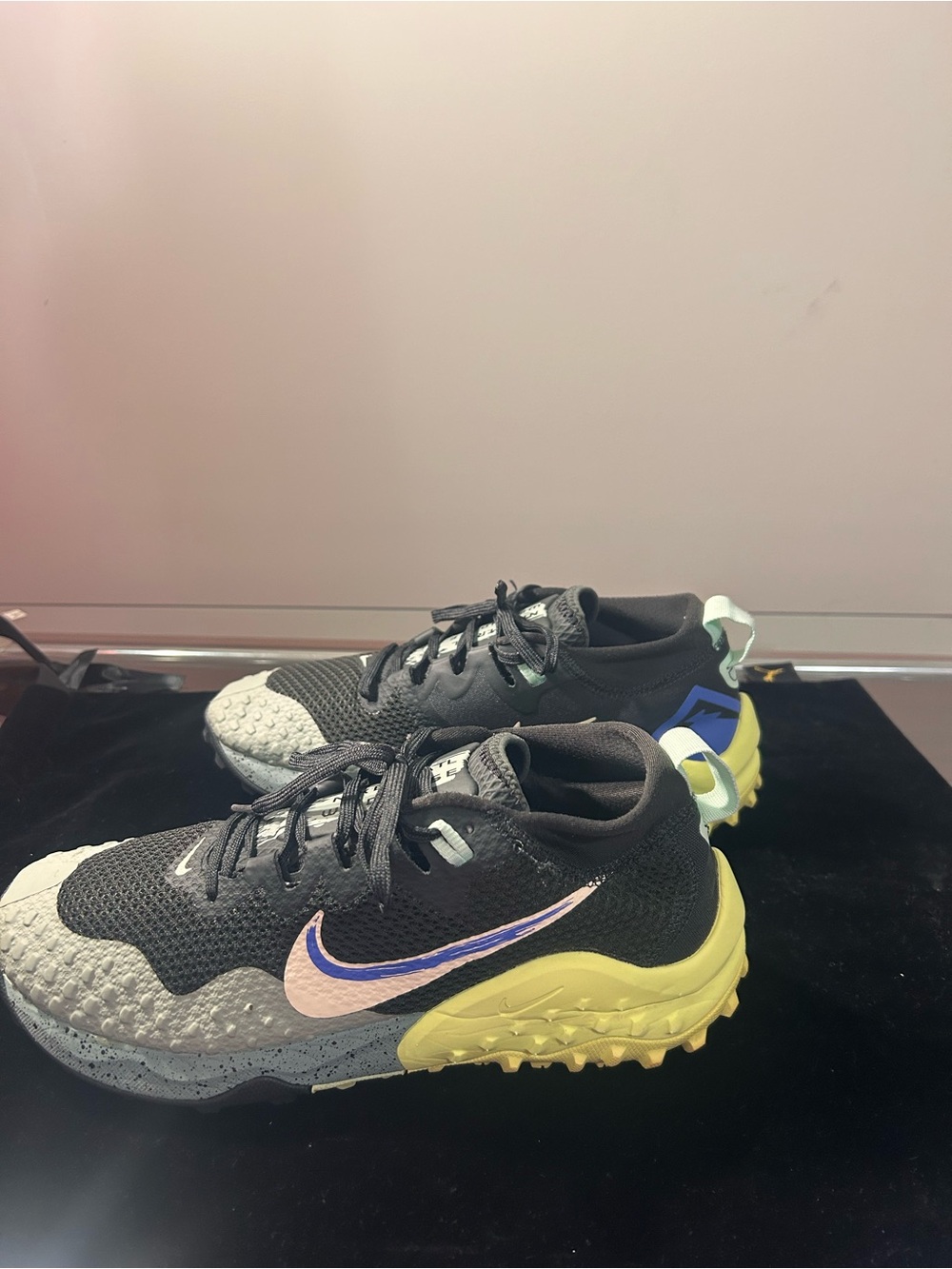 Womens Black and Yellow Trail Running Shoes with blue swoosh